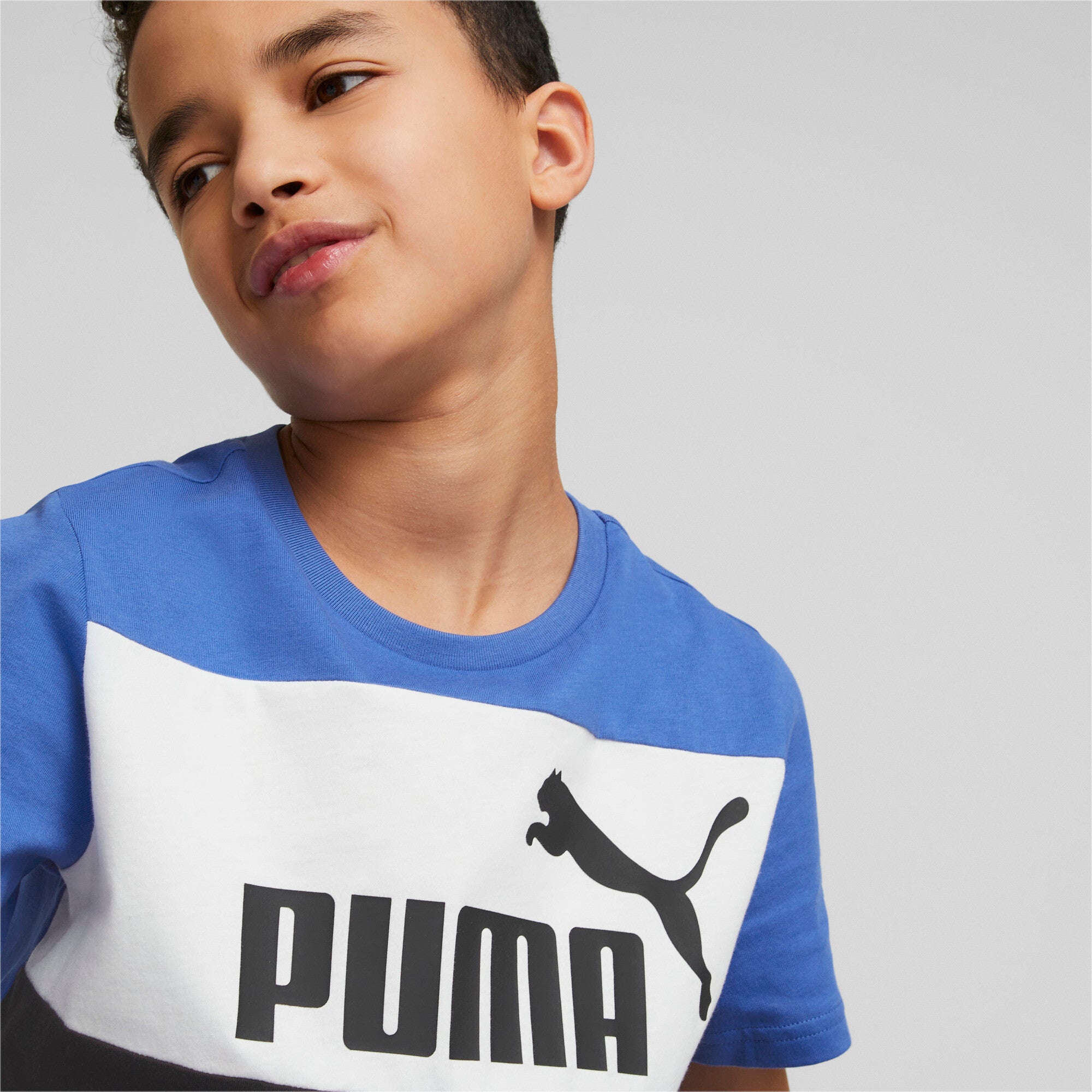 Puma essentials+ colour blocked youth tee in blue - Model Shot 02