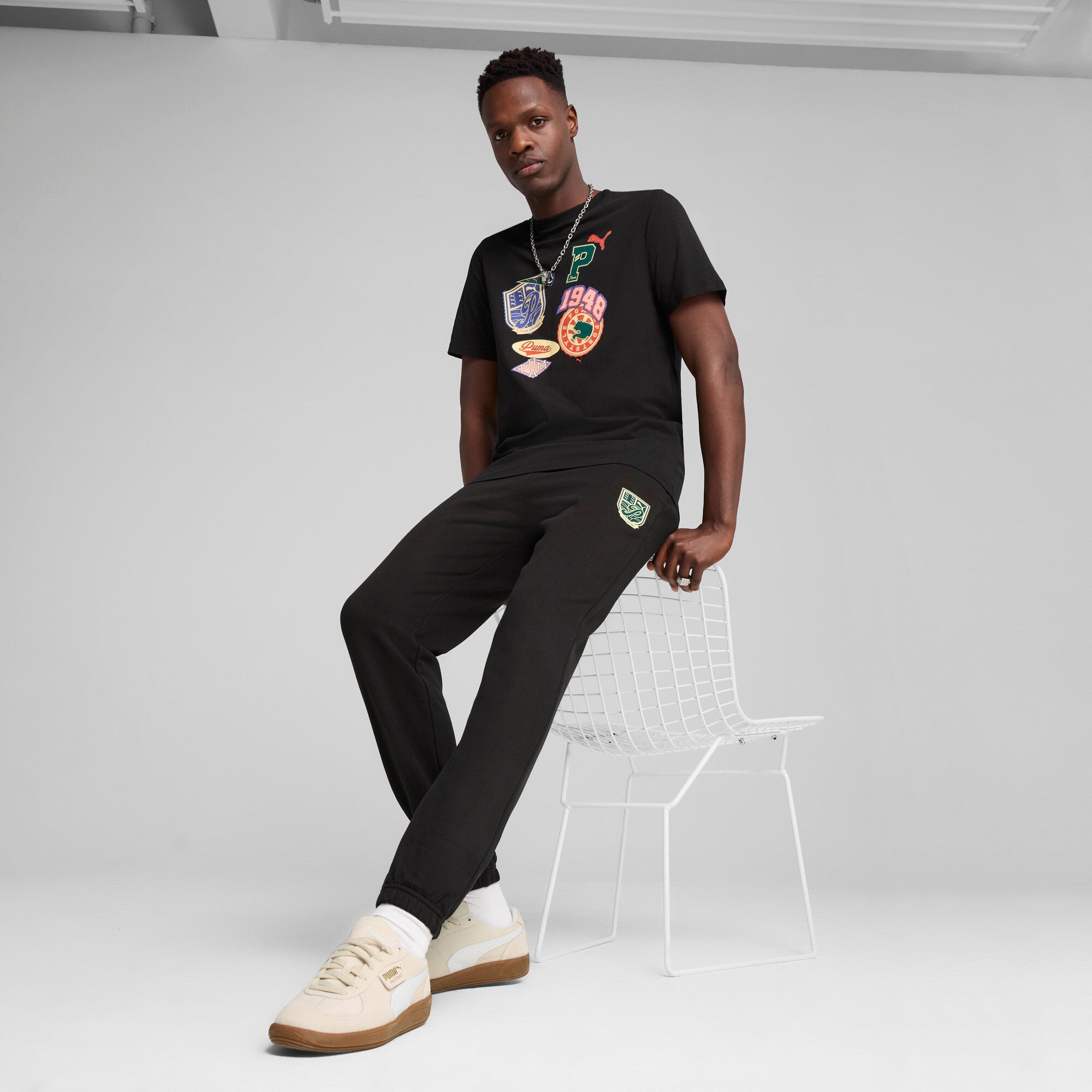 Puma sports legacy front graphic tee in black - Model Shot 03
