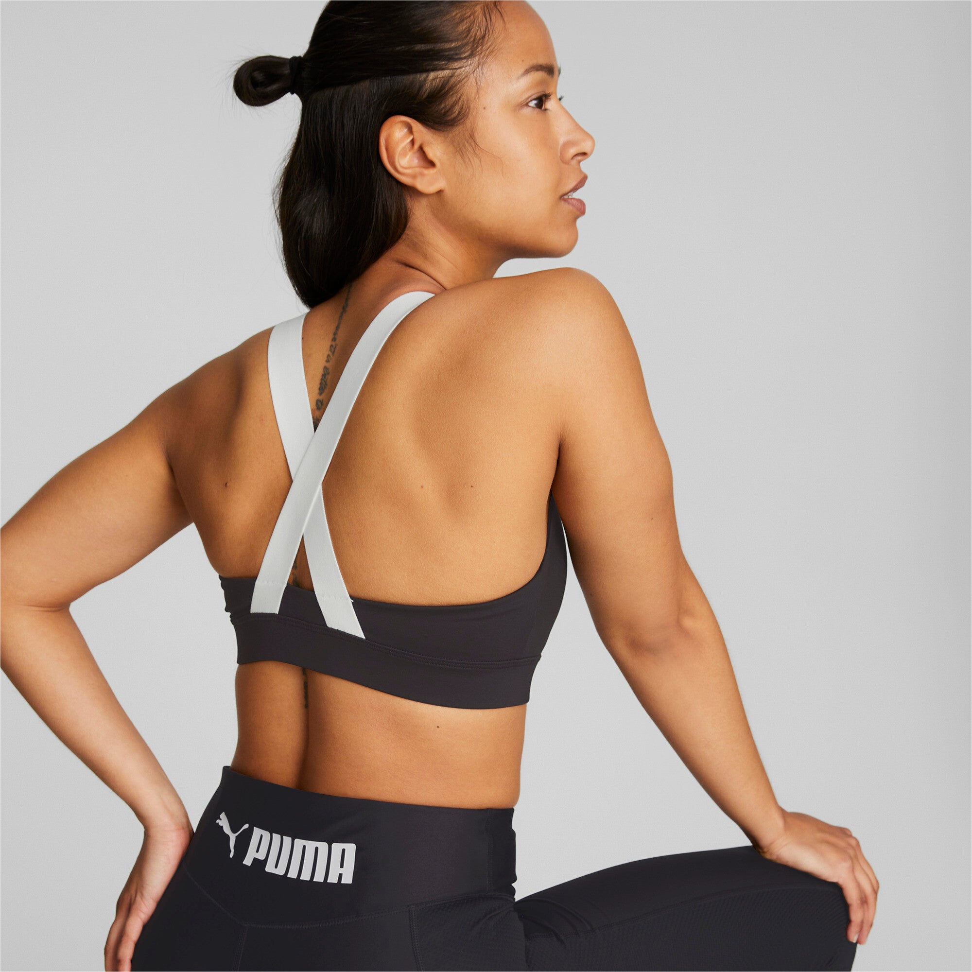 Puma fit mid impact training bra in black - Model Shot 03