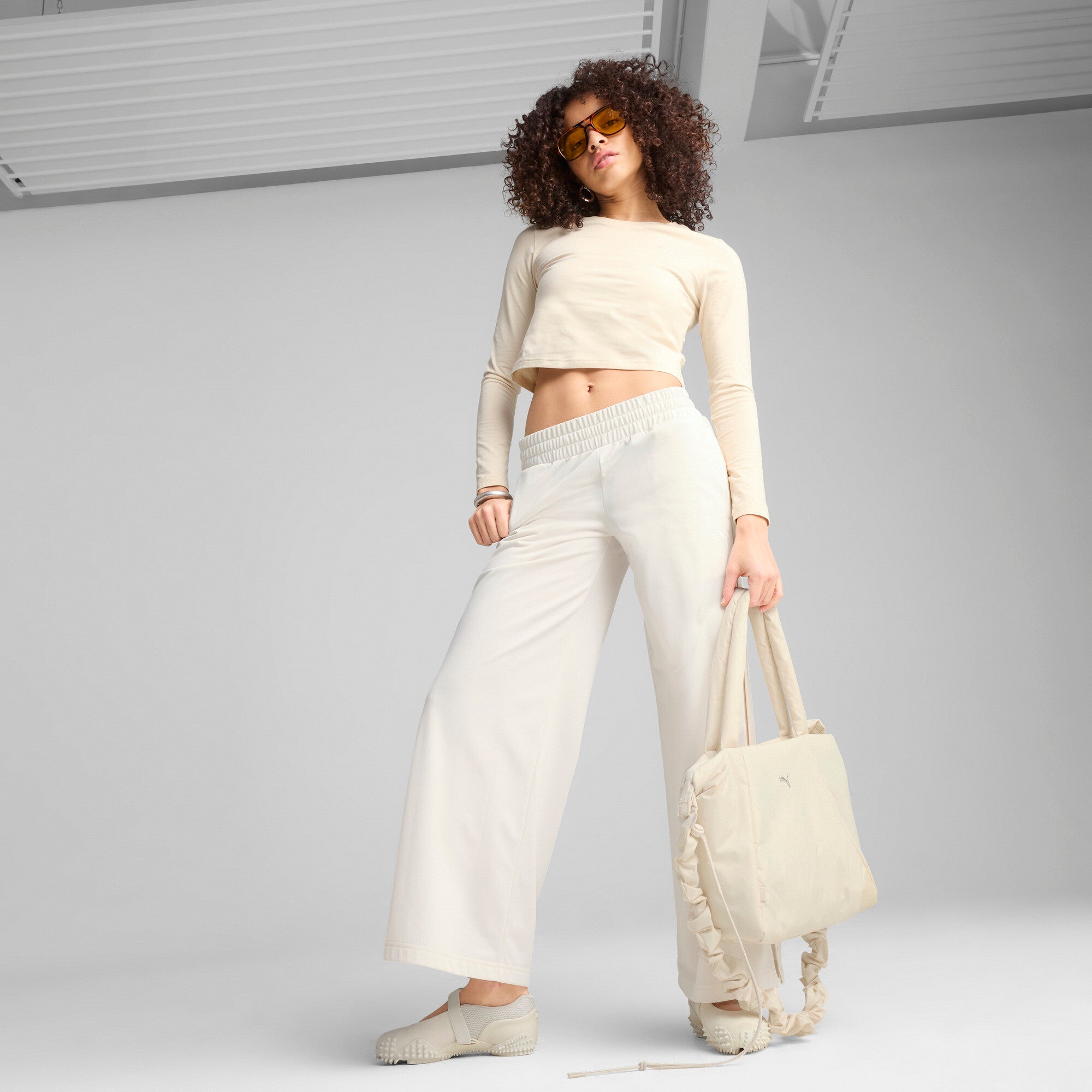 Puma wardrobe essentials low rise popper pants in white - Model Shot 03