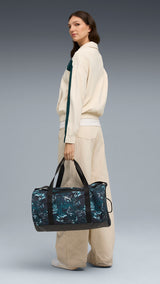PUMA ESSENTIALS training green terrains 28.5L barrel bag in green terrain - Image 1