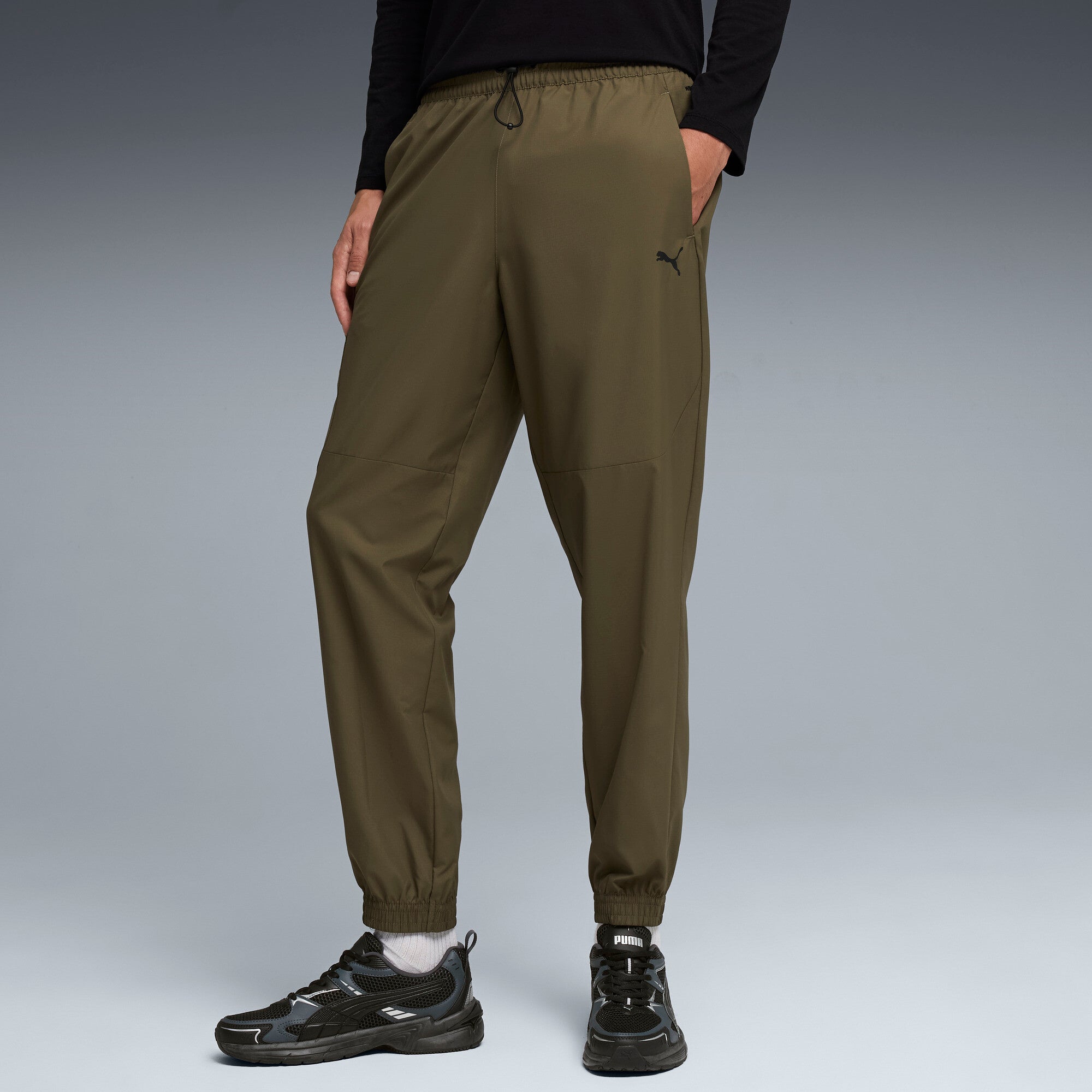 PUMA PUMATECH woven cargo pants men in loden green
