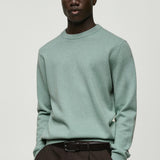 Mango sweater cash in water