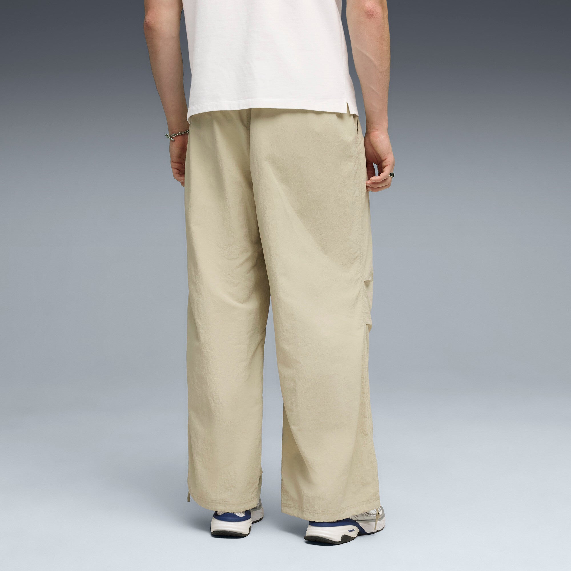 PUMA wardrobe essentials oversized parachute pants men in pebble gray — model shot 2
