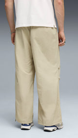 PUMA wardrobe essentials oversized parachute pants men in pebble gray — model shot 2