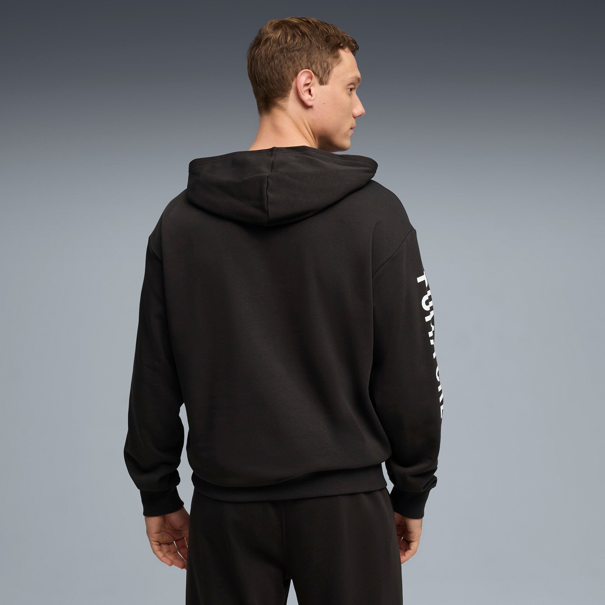 PUMA graphics training hoodie men in black — model shot 2