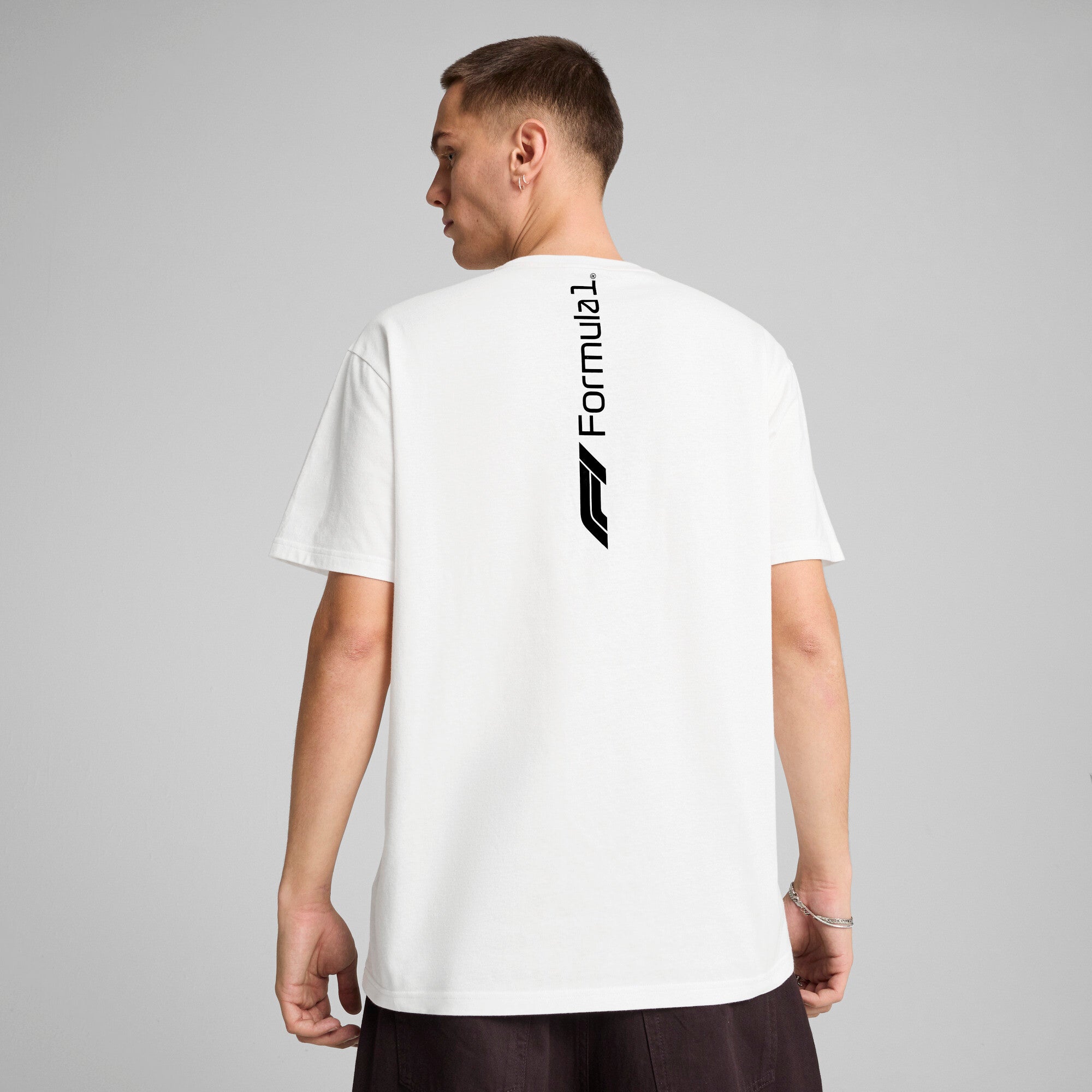 Puma F1® ESS+ relaxed graphic tee in white - Model Shot 02