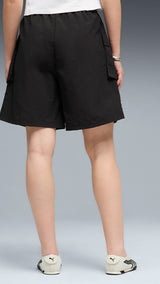 PUMA wardrobe essentials cargo shorts women in black — model shot 2