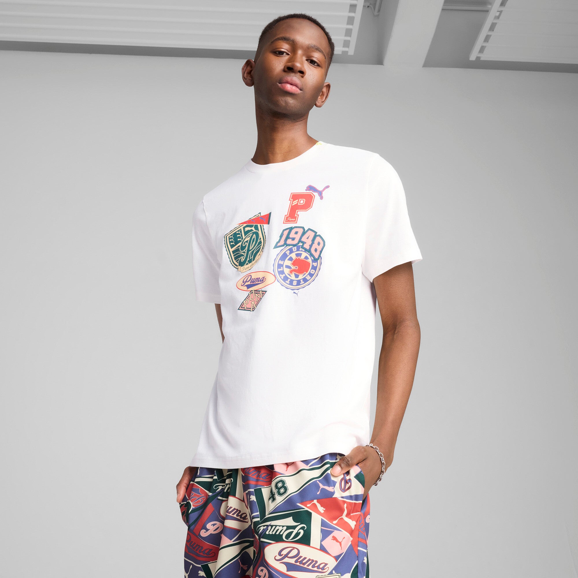 Puma sports legacy front graphic tee in white - Model Shot 01