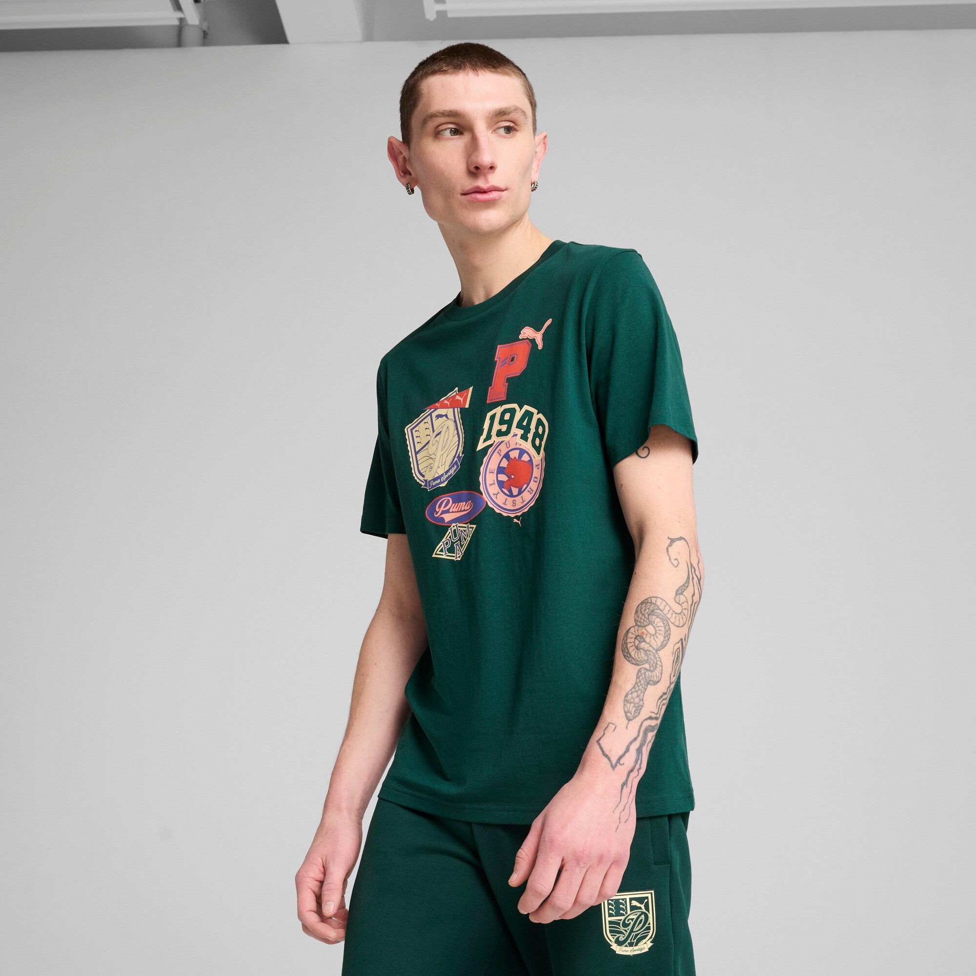 Puma sports legacy front graphic tee in dark myrtle - Model Shot 01
