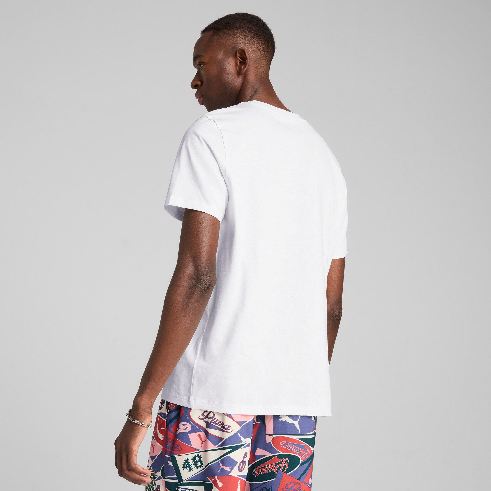 Puma sports legacy front graphic tee in white - Model Shot 02