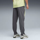 PUMA FLEX STRETCH woven training pants in gray and green — model shot 2
