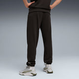 PUMA graphics training jogger pants men in black — model shot 2