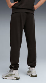 PUMA graphics training jogger pants men in black — model shot 2