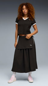 PUMA wardrobe essentials polo women in black — model shot 3