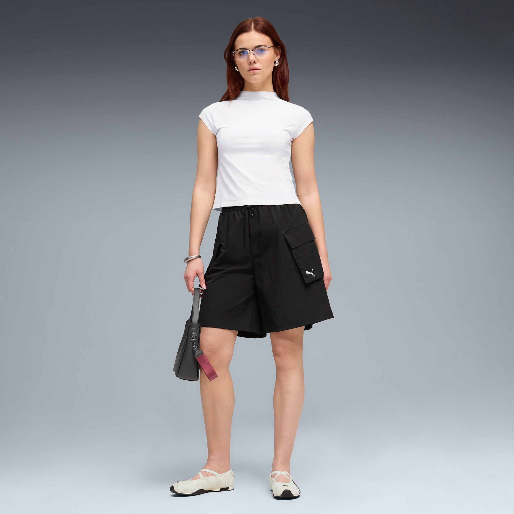 PUMA wardrobe essentials cargo shorts women in black — model shot 3