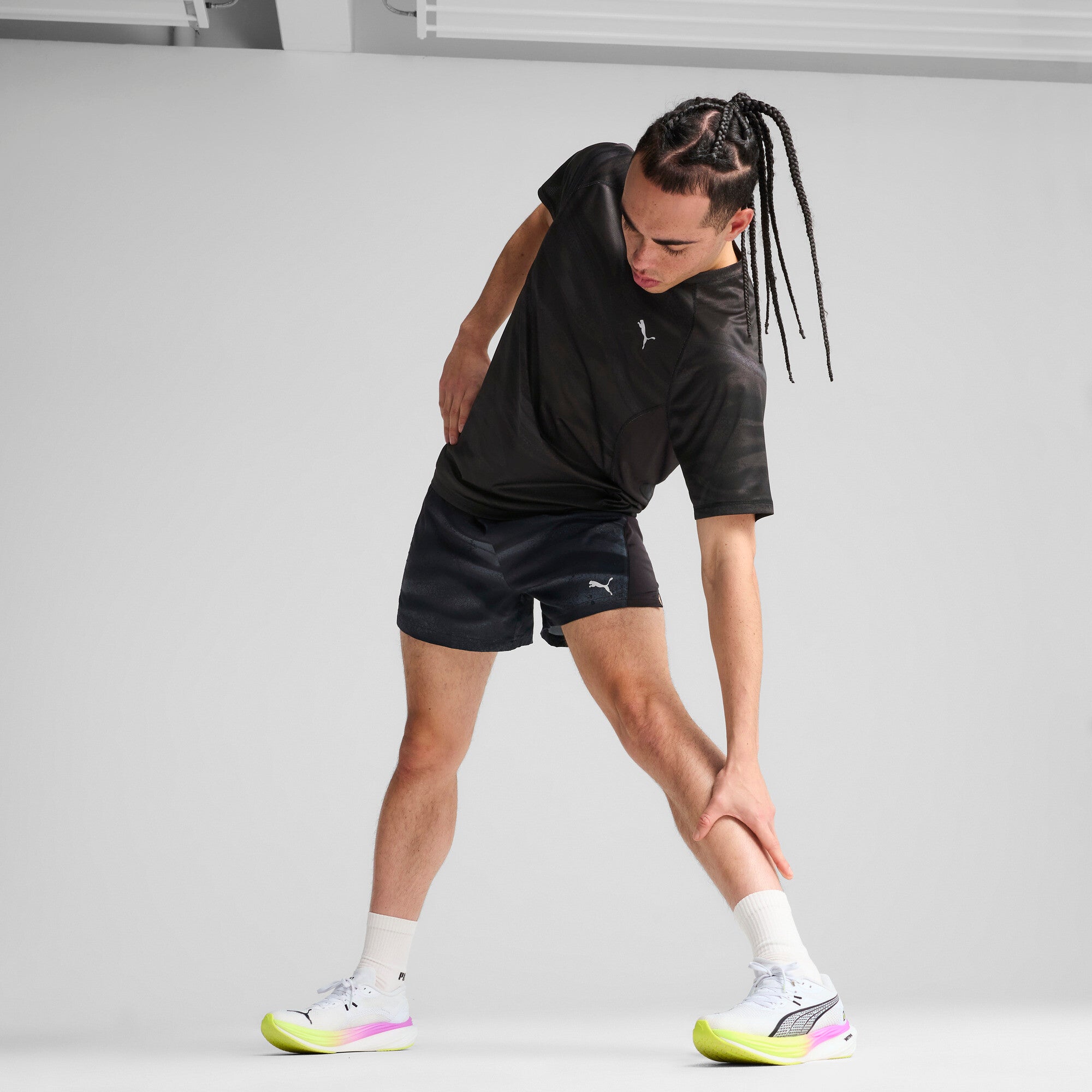 Puma running velocity all-over print tee in black - Model Shot 03