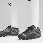 Puma football attacanto fg/ag boots in black - Model Shot 01