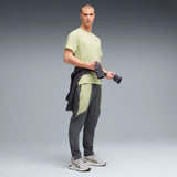PUMA FLEX STRETCH woven training pants in gray and green — model shot 3
