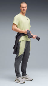 PUMA FLEX STRETCH woven training pants in gray and green — model shot 3