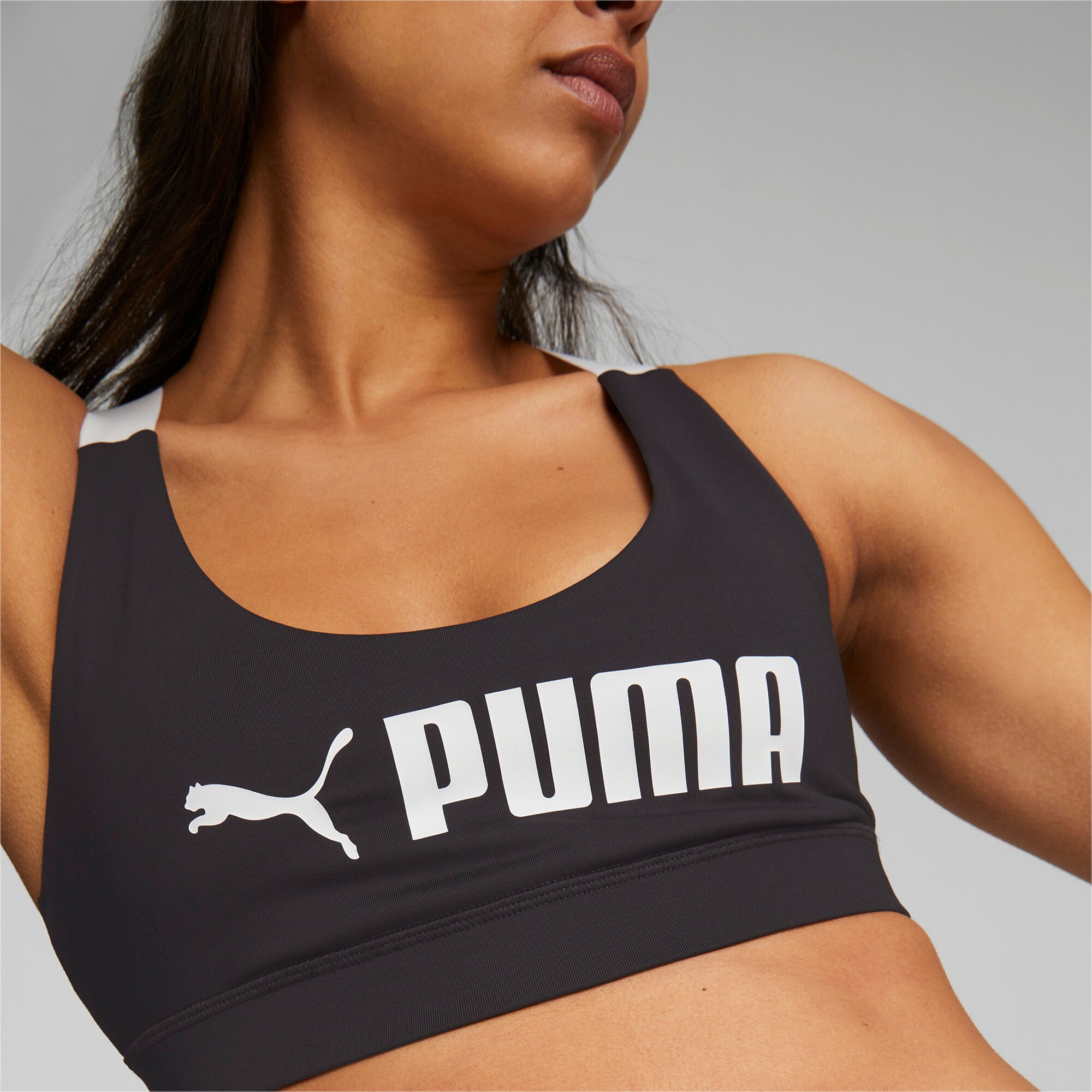 Puma fit mid impact training bra in black - Model Shot 02