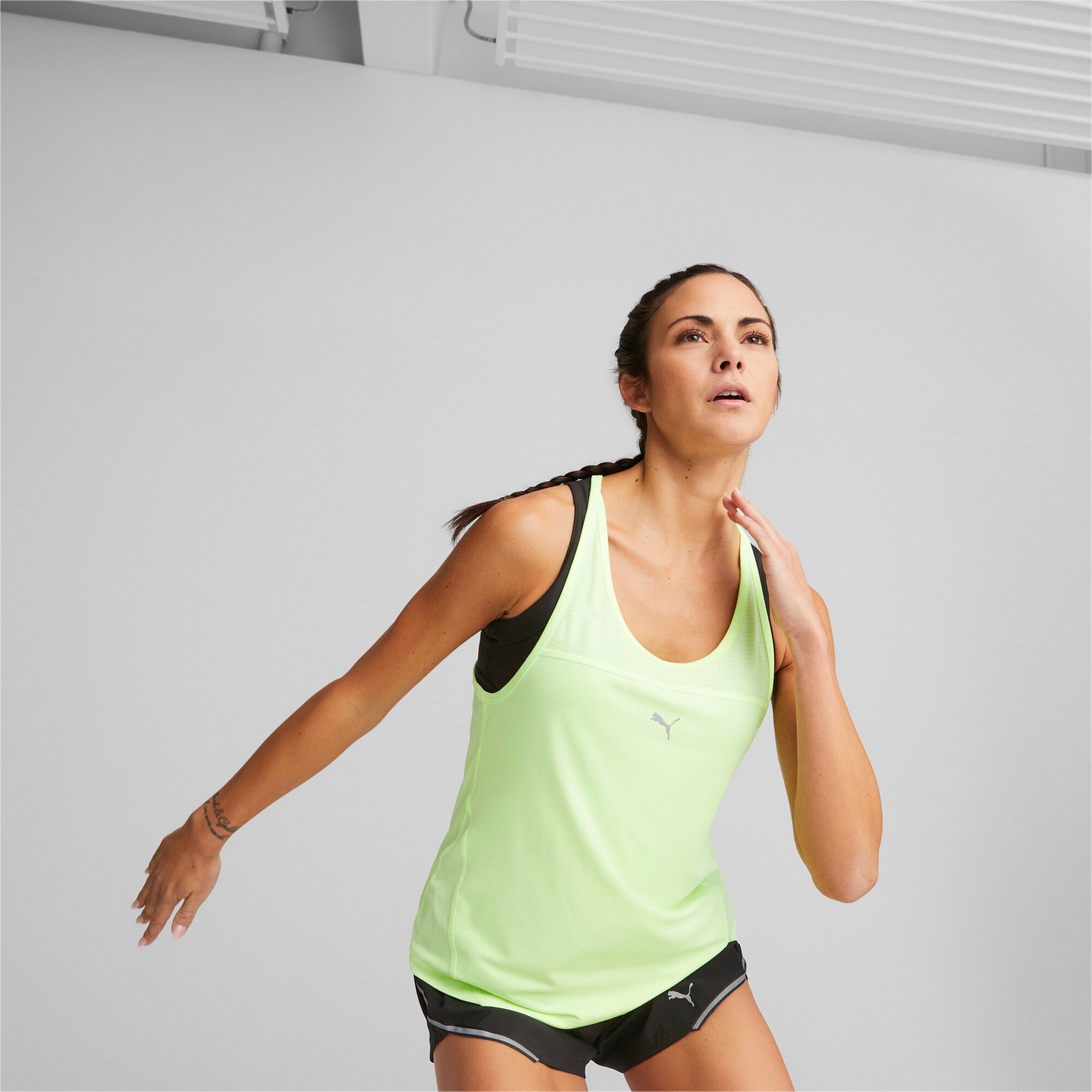 Puma run running tank top women in yellow - Model Shot 01