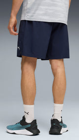 PUMA TRAIN ALL DAY foundations woven 7" shorts men in navy — model shot 2