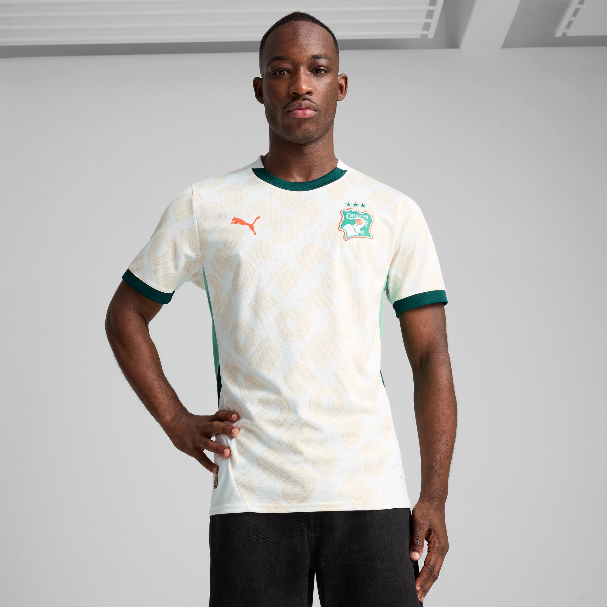 PUMA Côte d'Ivoire 2025 away jersey in white and dark myrtle - Model Shot 01