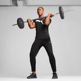PUMA TAD ESSENTIALS solid cat tee men (525921) in black — model shot 3