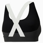 Puma fit mid impact training bra in black - Back View