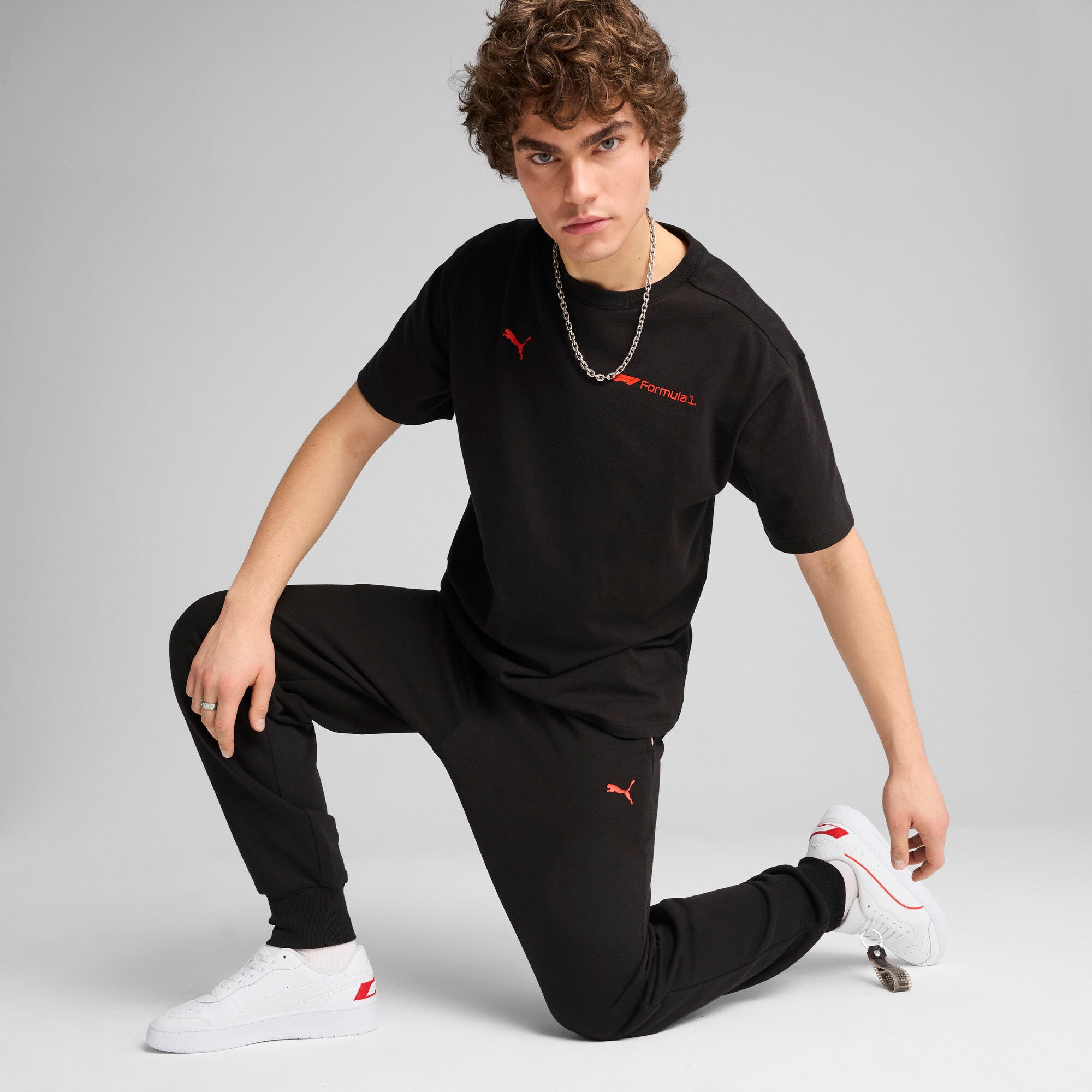 Puma F1® ESS+ relaxed graphic tee in black - Model Shot 03