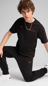 Puma F1® ESS+ relaxed graphic tee in black - Model Shot 03