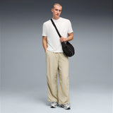 PUMA wardrobe essentials oversized parachute pants men in pebble gray — model shot 3