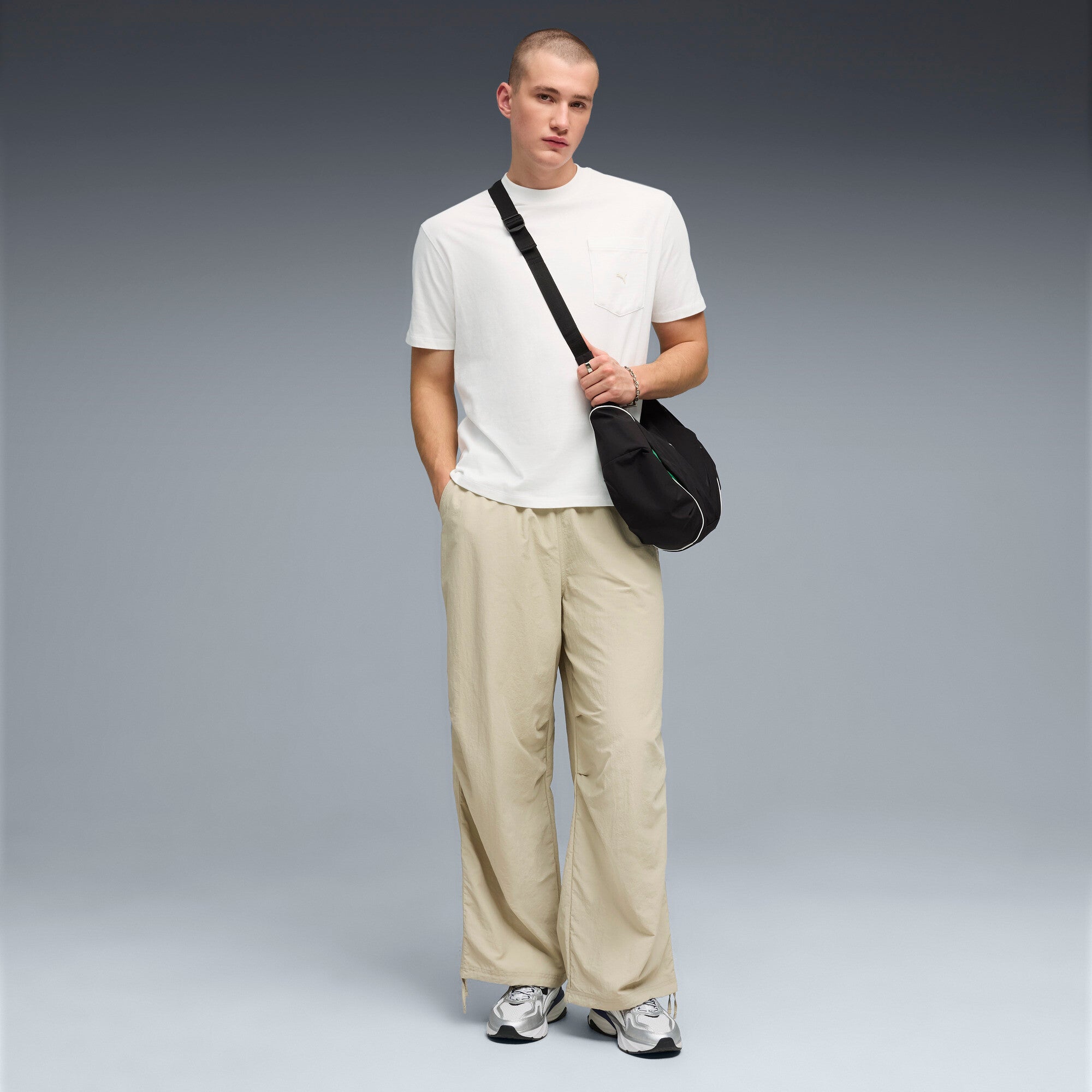 PUMA wardrobe essentials oversized parachute pants men in pebble gray — model shot 3