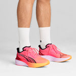Puma darter Pro running shoes in sun stream and sunset glow - Model Shot 01