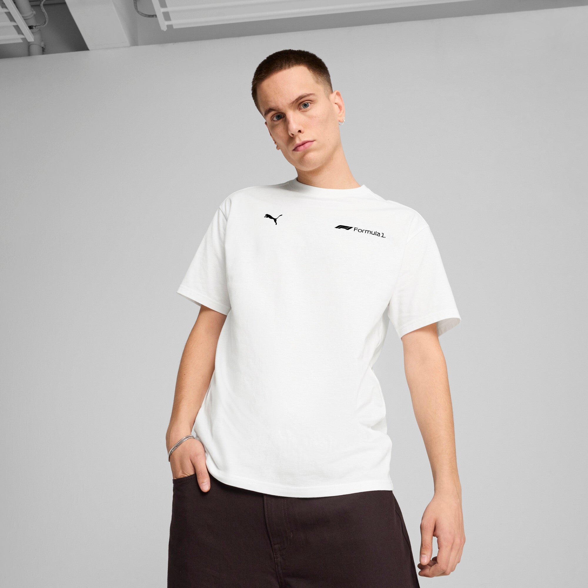 Puma F1® ESS+ relaxed graphic tee in white - Model Shot 01