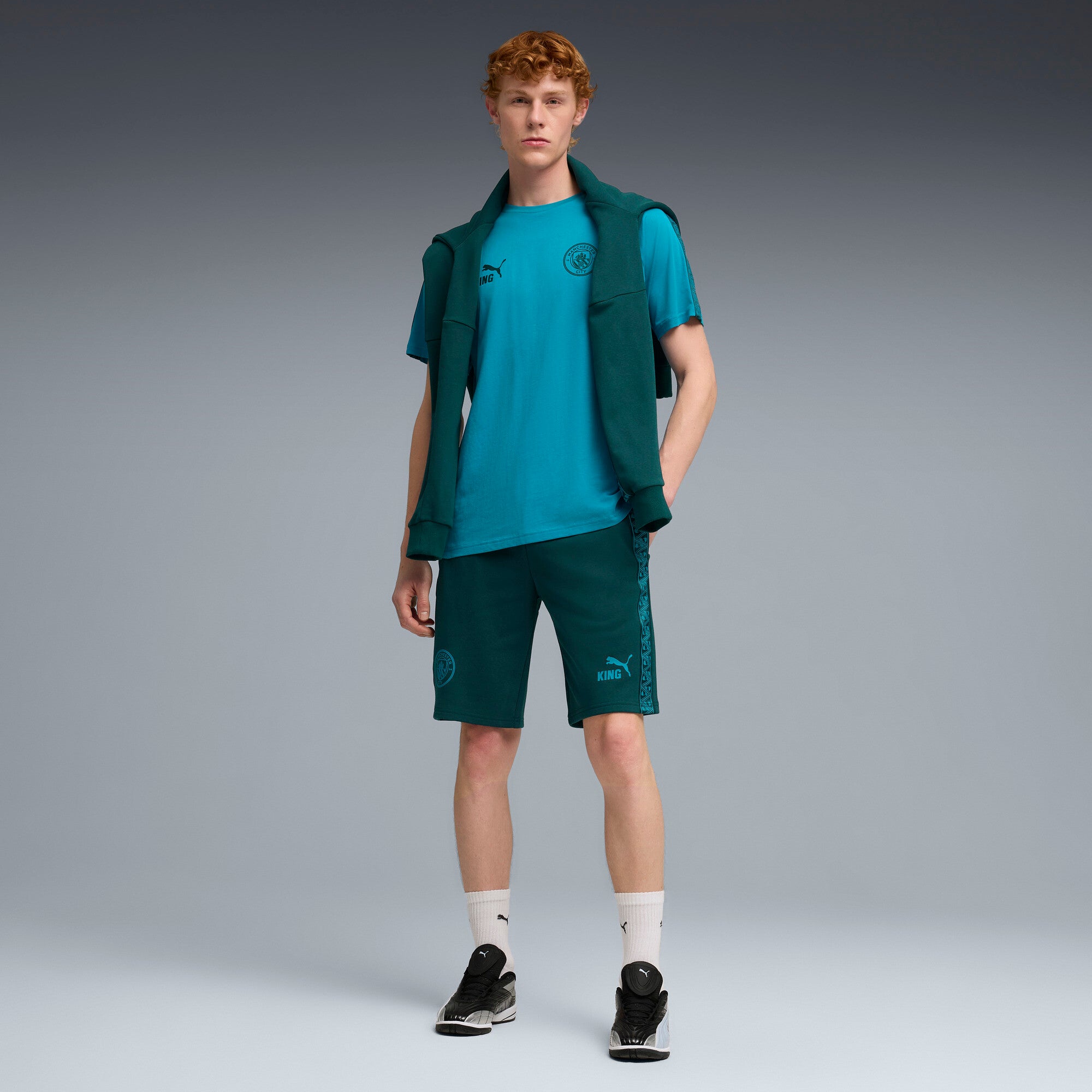 PUMA manchester city KING sweat shorts men in green and blue — model shot 3
