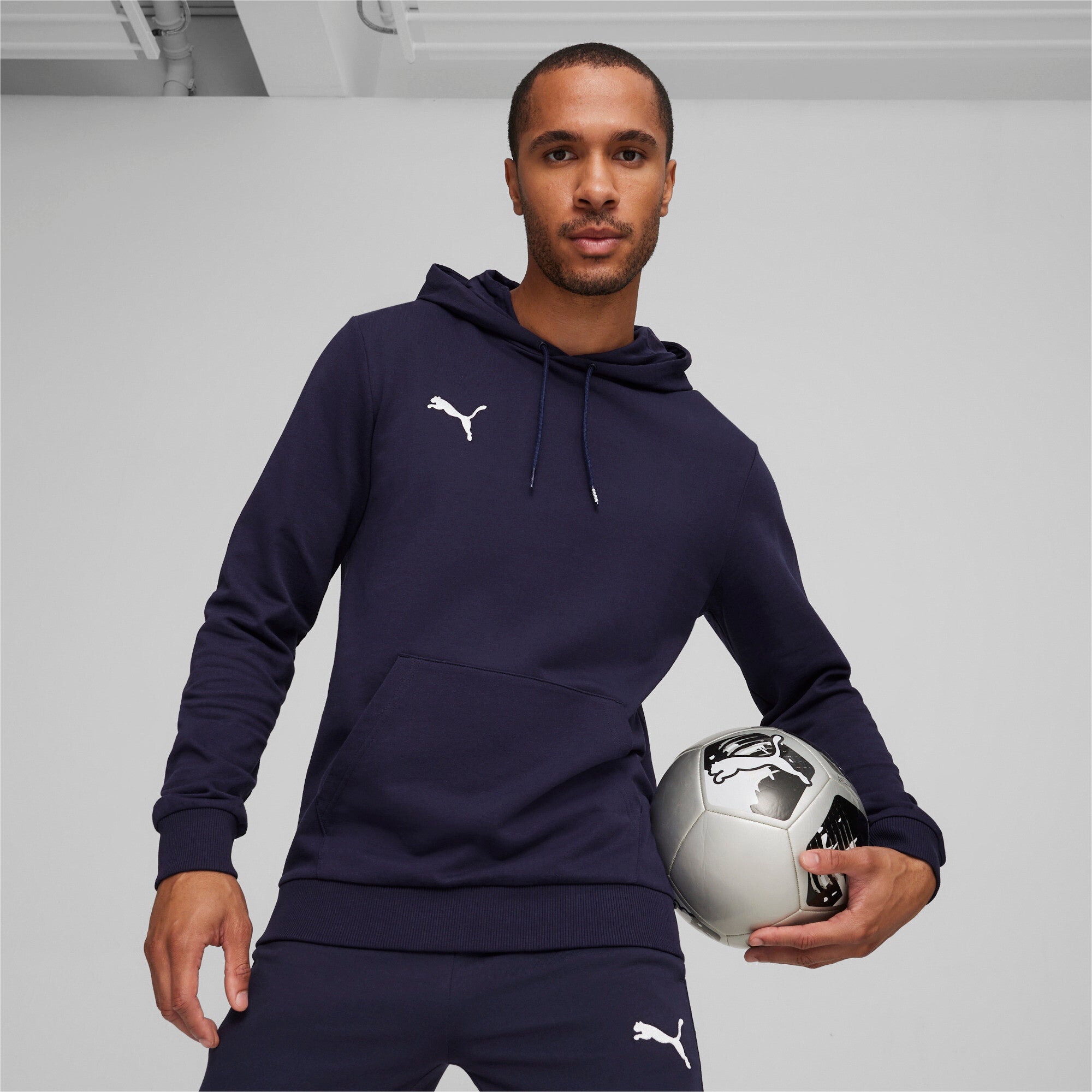 Puma teamGOAL casuals football hoodie in navy and white - Model Shot 01