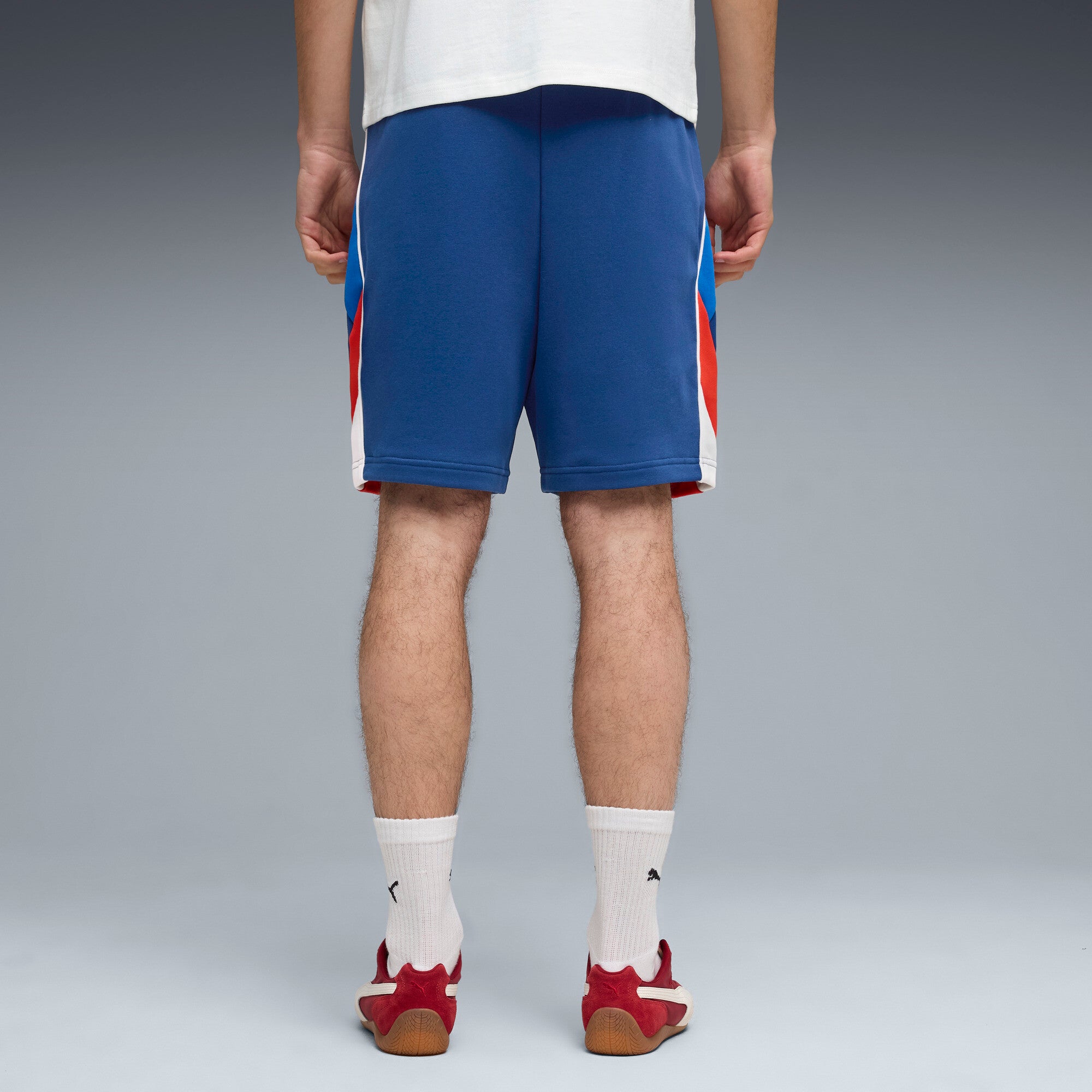 PUMA BMW M MOTORSPORT sportswear 7" shorts men in pro blue — model shot 2