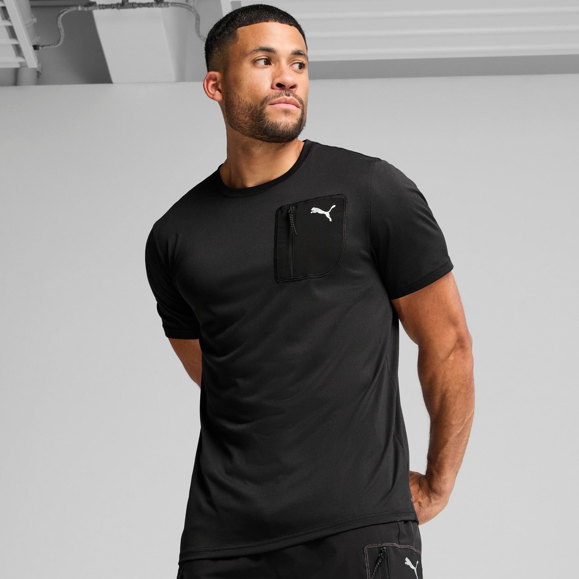 Puma flex pocket tee in black - Model Shot 01