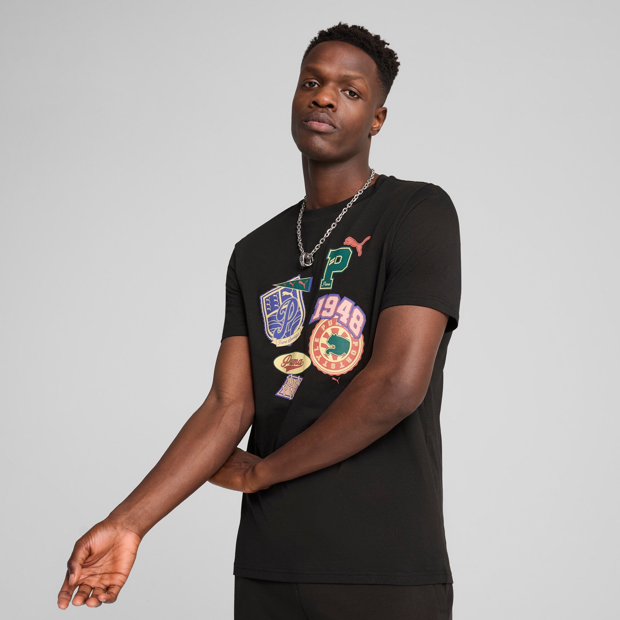 Puma sports legacy front graphic tee in black - Model Shot 01