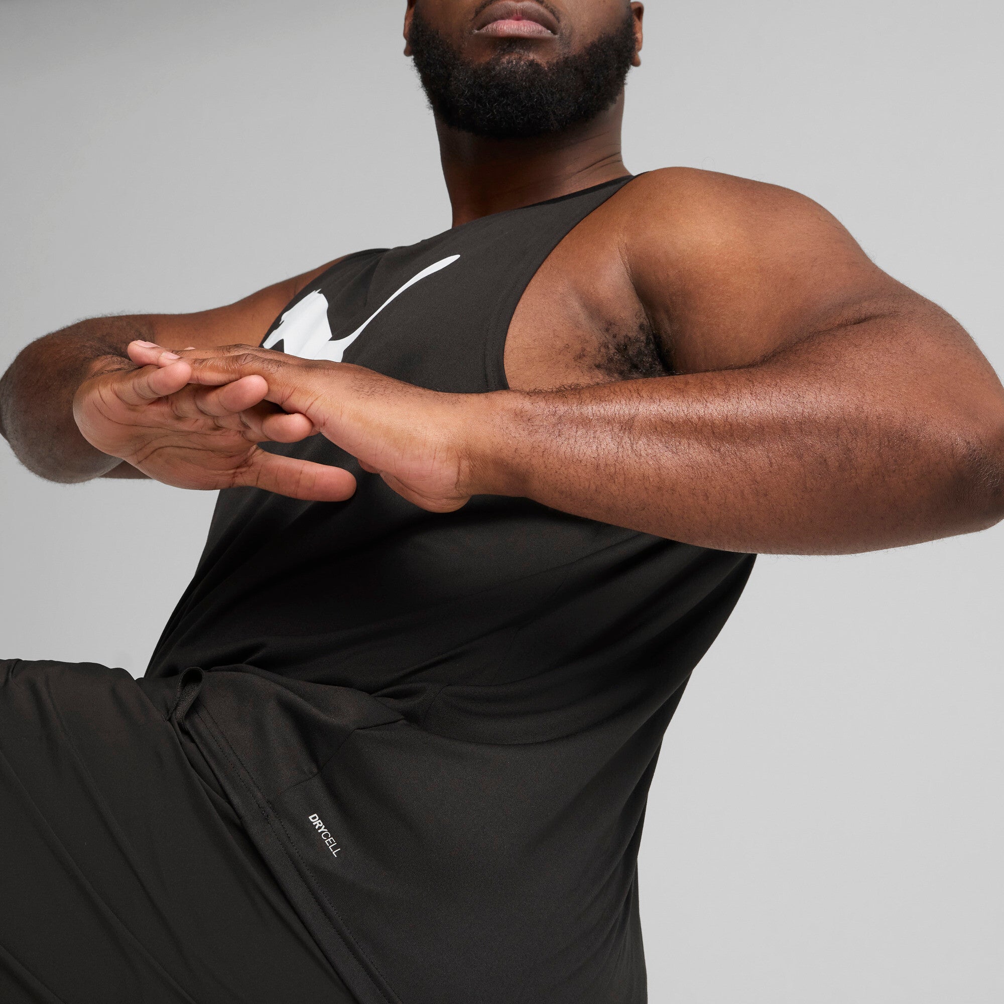 PUMA TAD ESSENTIALS sleeveless tank men in black — model shot 2