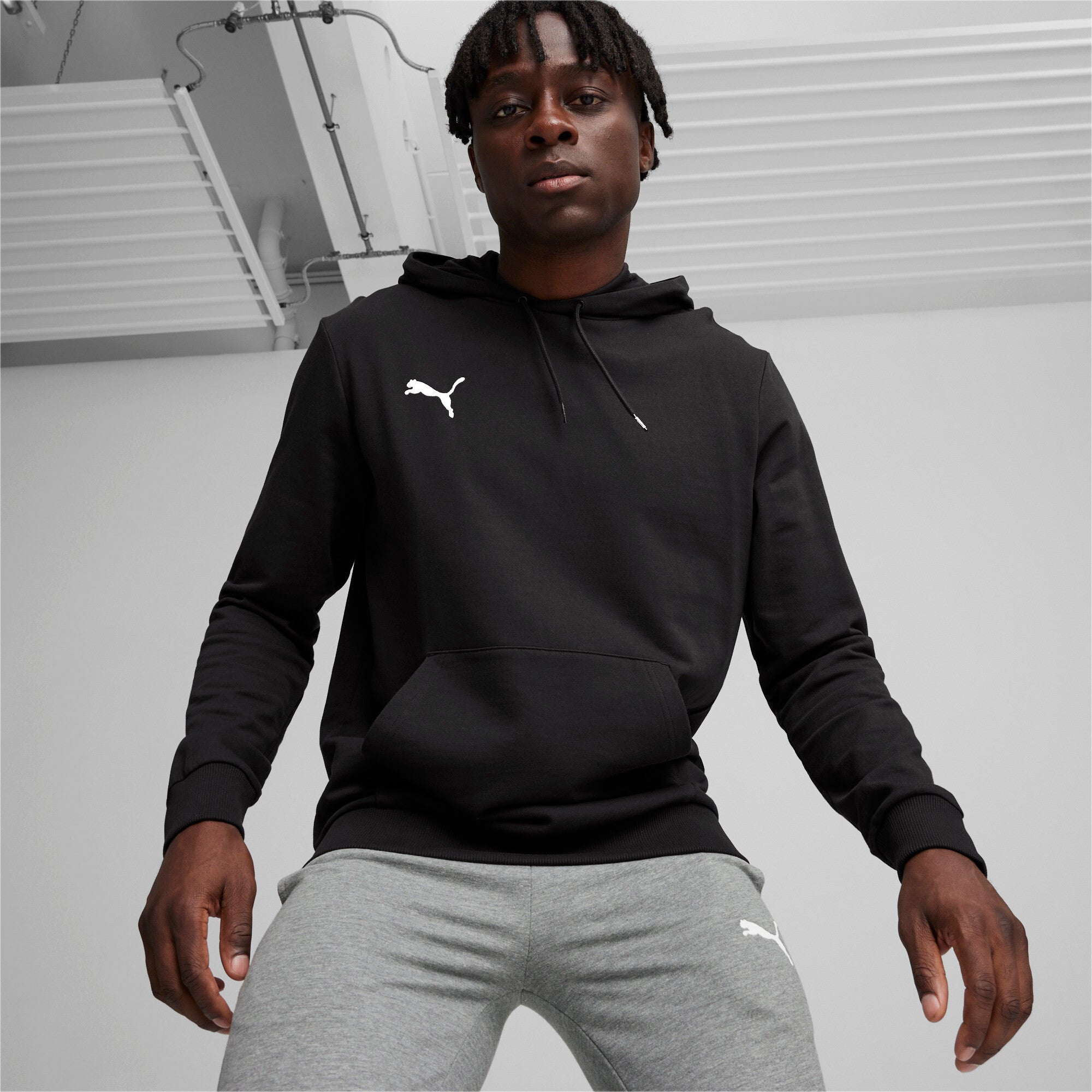 Puma teamGOAL casuals football hoodie in black and white - Model Shot 01