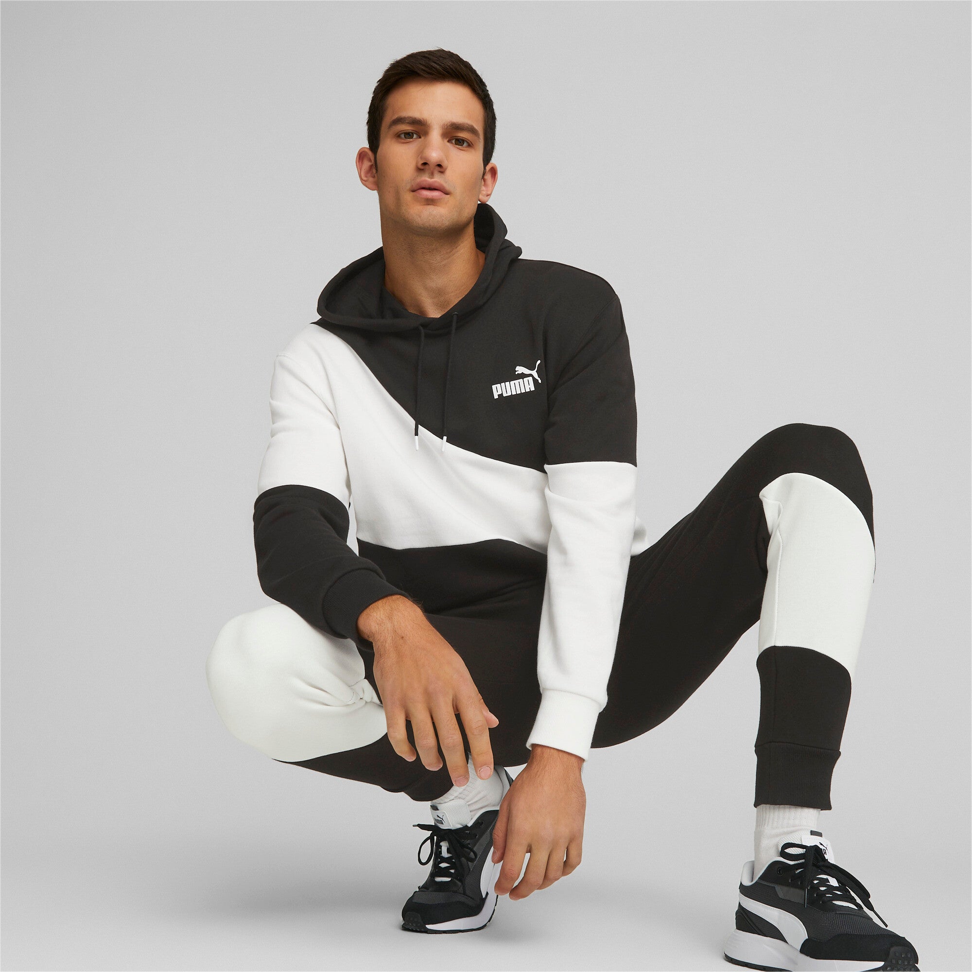 Puma power cat sweatpants in black - Model Shot 02