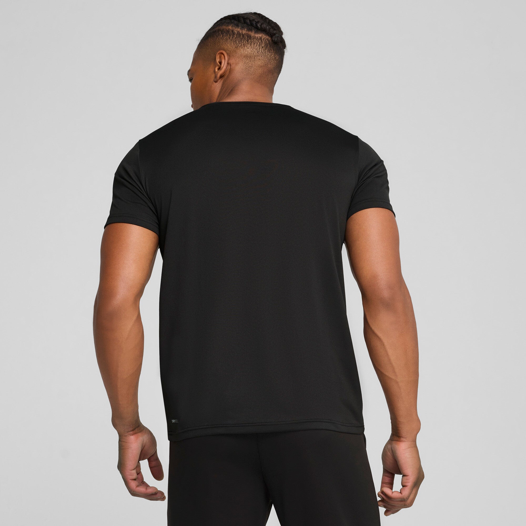 PUMA TAD ESSENTIALS solid cat tee men (525921) in black — model shot 2