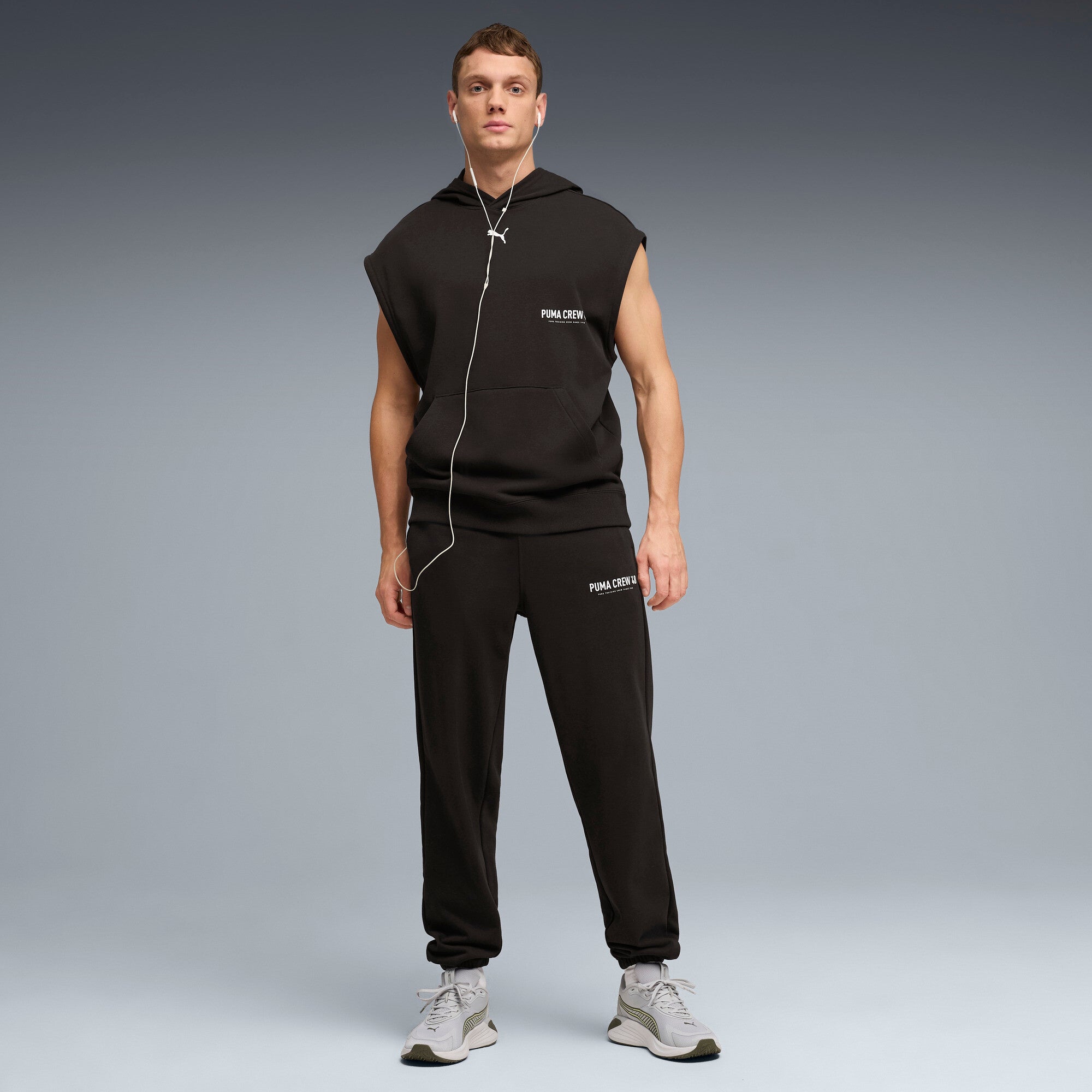 PUMA graphics training jogger pants men in black — model shot 3