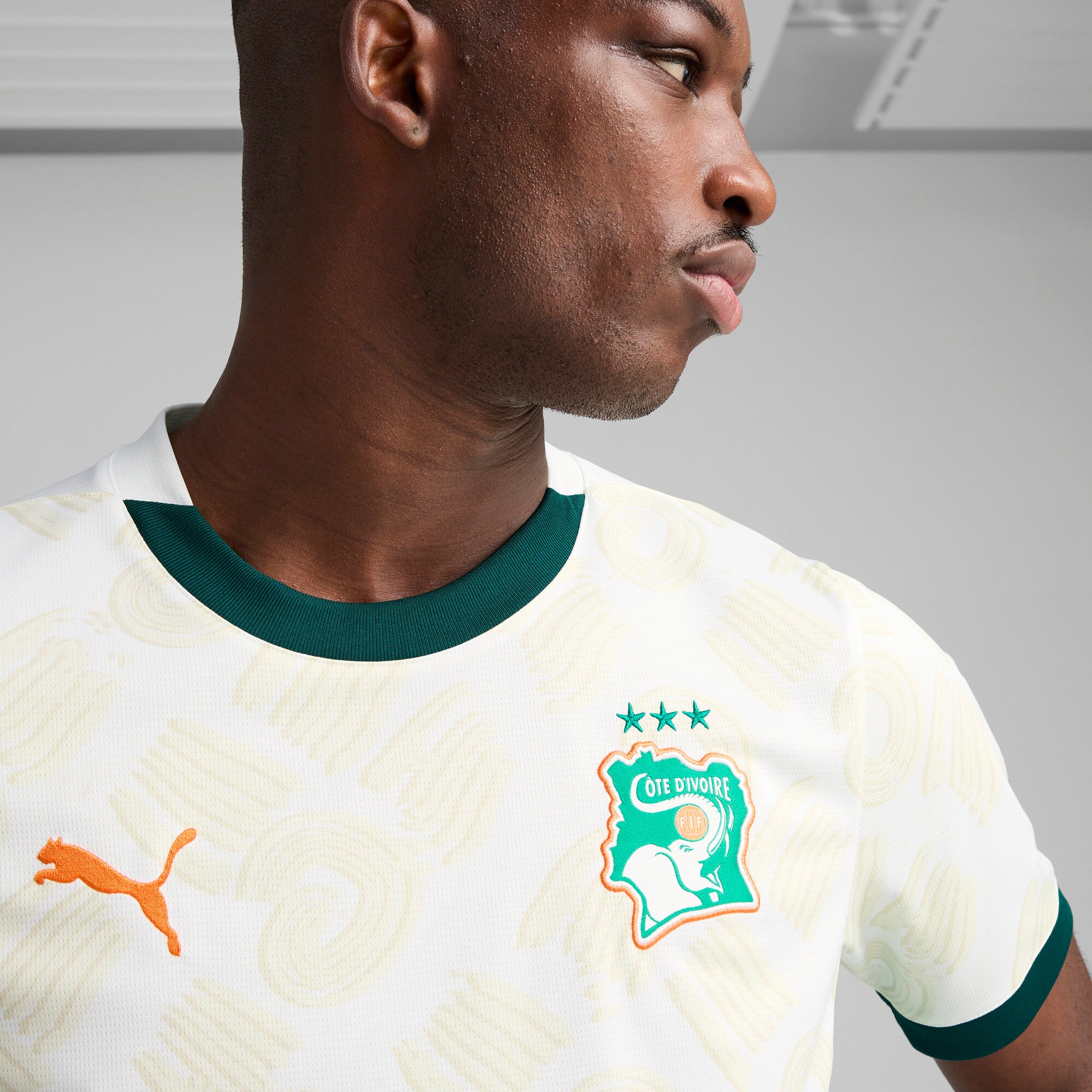 PUMA Côte d'Ivoire 2025 away jersey in white and dark myrtle - Model Shot 02