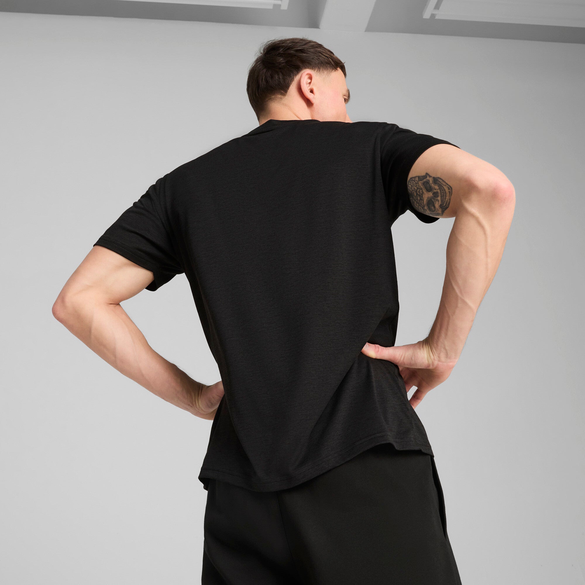 PUMA TAD ESSENTIALS heather cat tee men in black heather — model shot 2