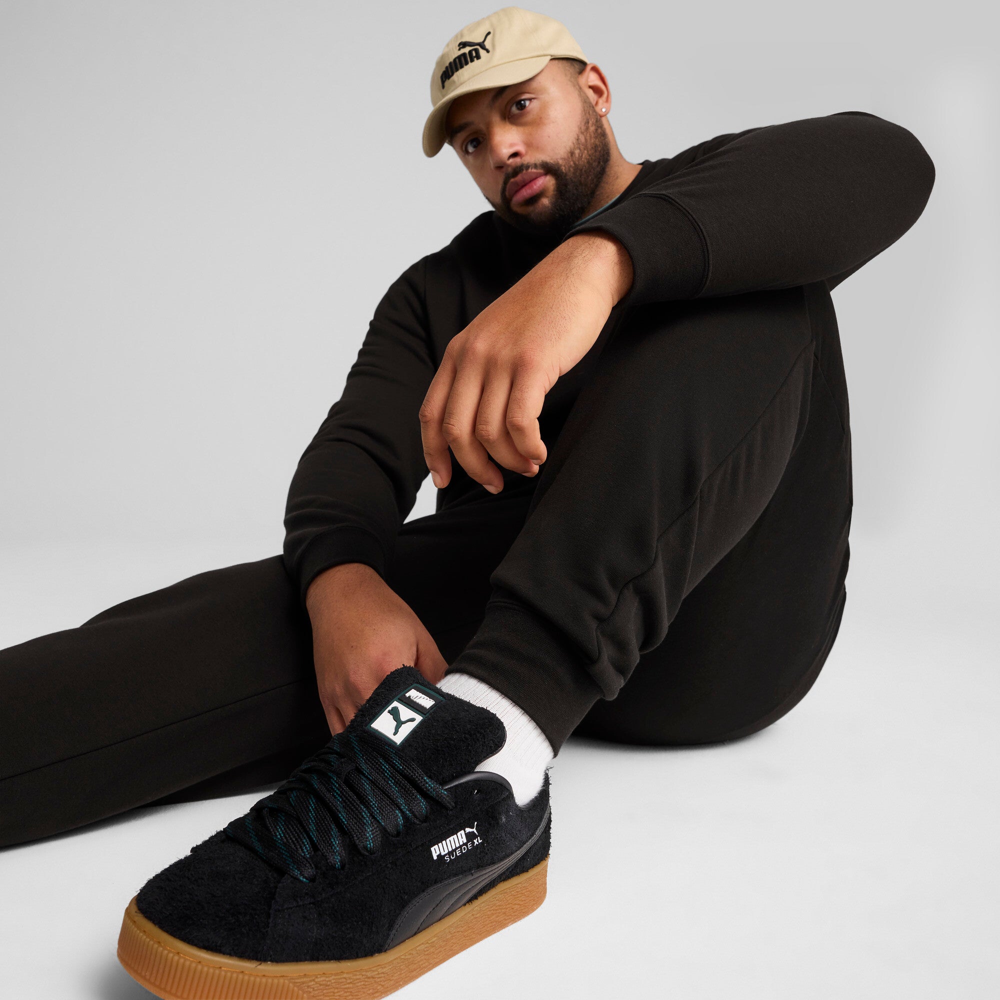 PUMA essentials no. 1 logo sweatpants men in black — model shot 2