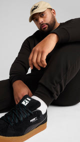 PUMA essentials no. 1 logo sweatpants men in black — model shot 2